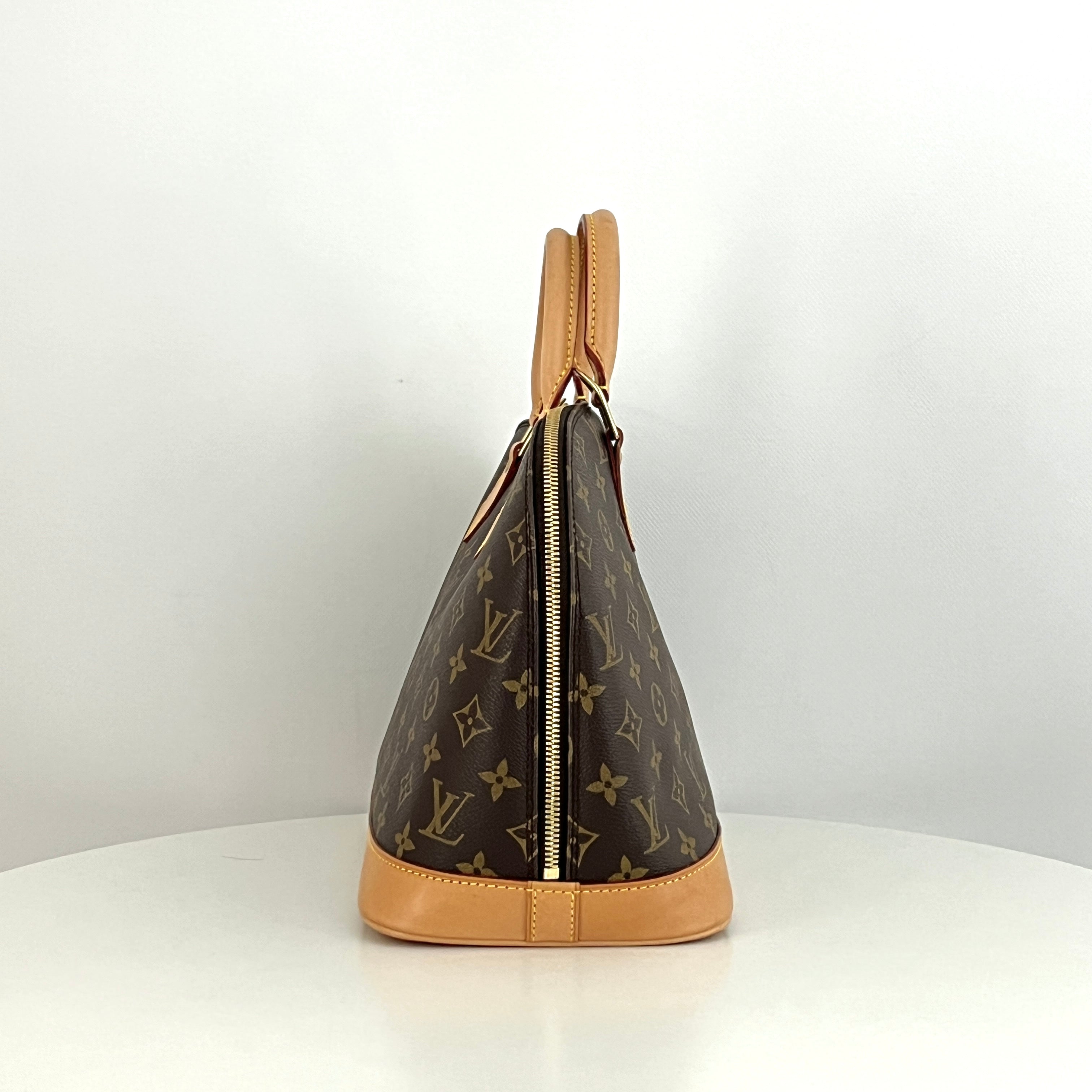 LOUIS VUITTON Alma PM handbag in brown canvas and leather