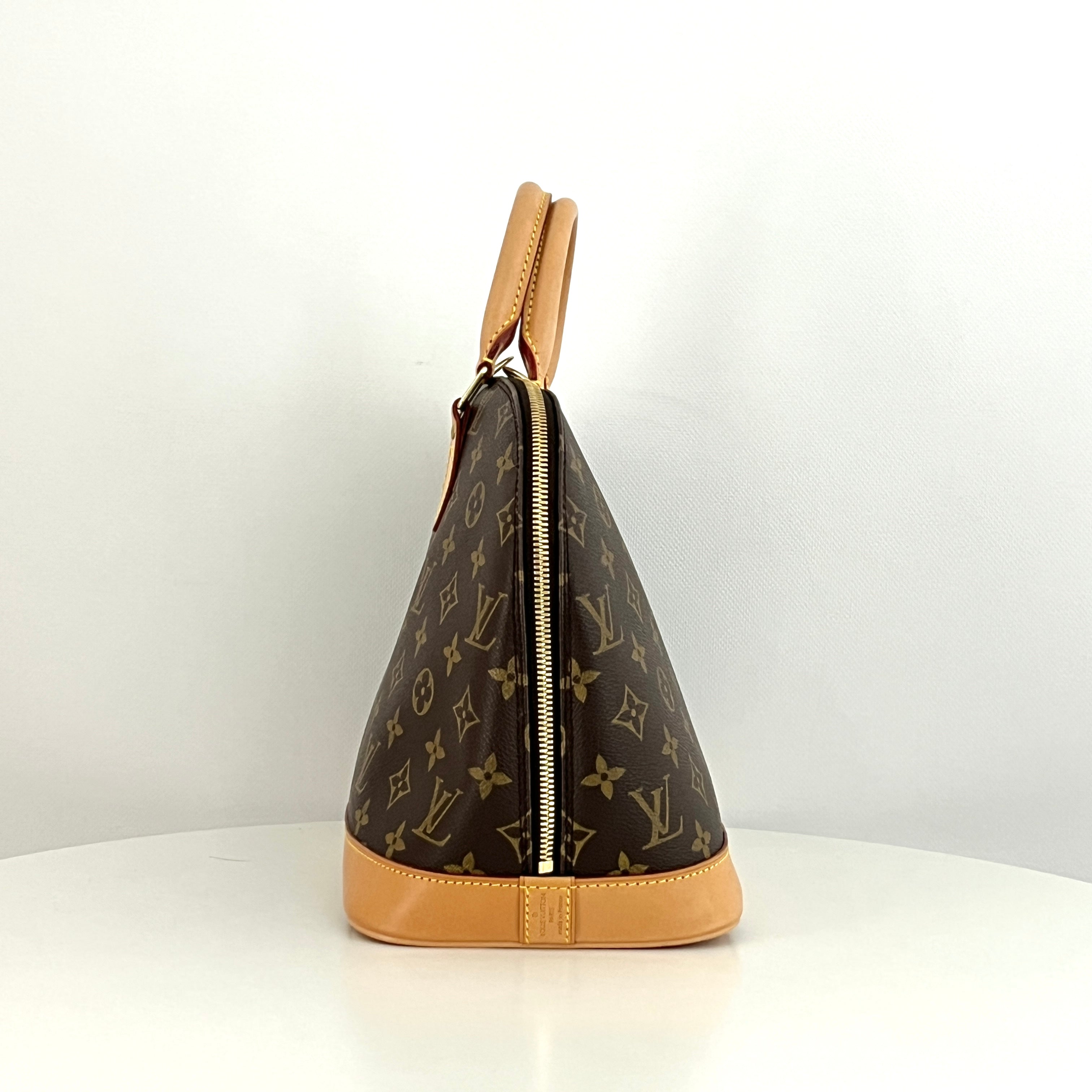 LOUIS VUITTON Alma PM handbag in brown canvas and leather