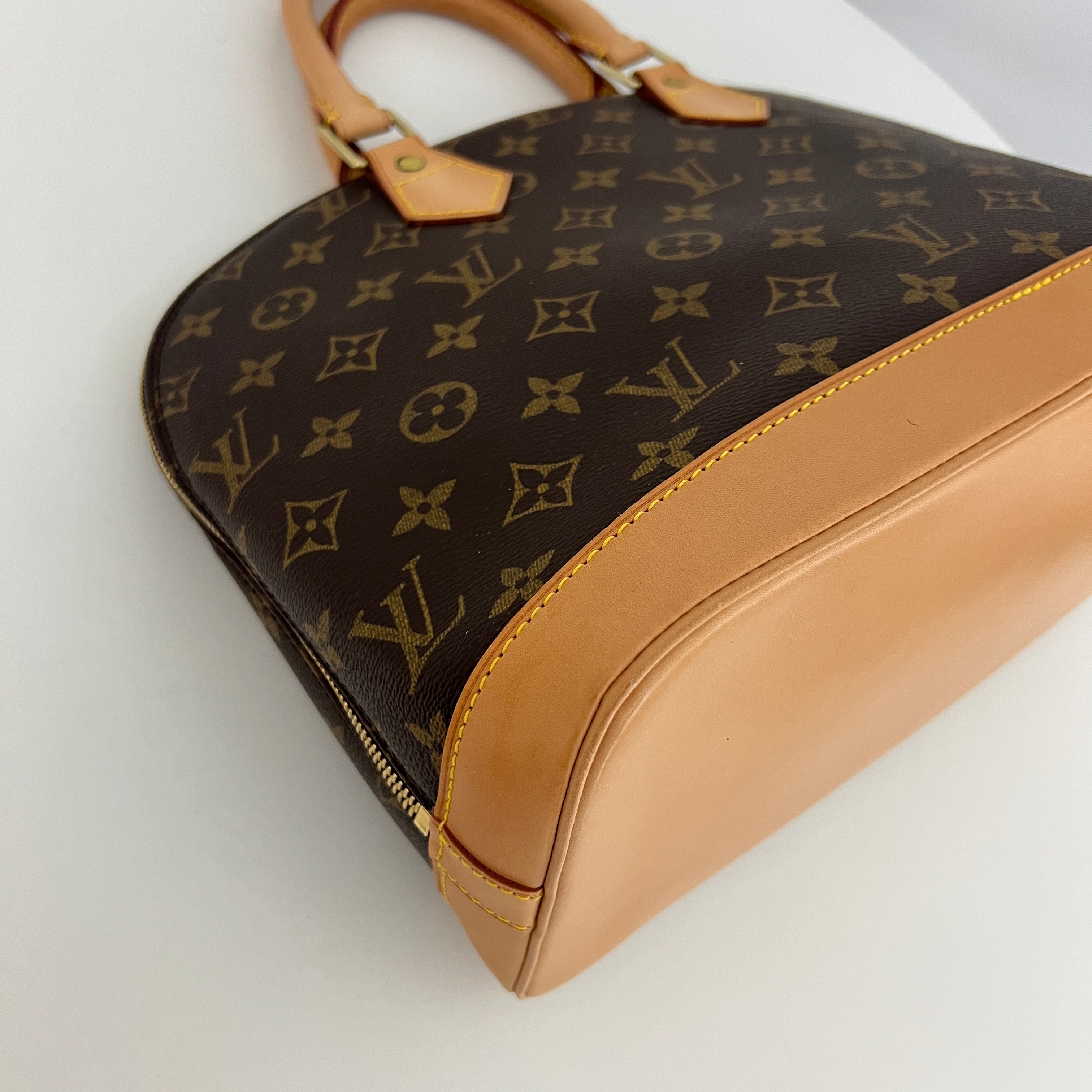 LOUIS VUITTON Alma PM handbag in brown canvas and leather