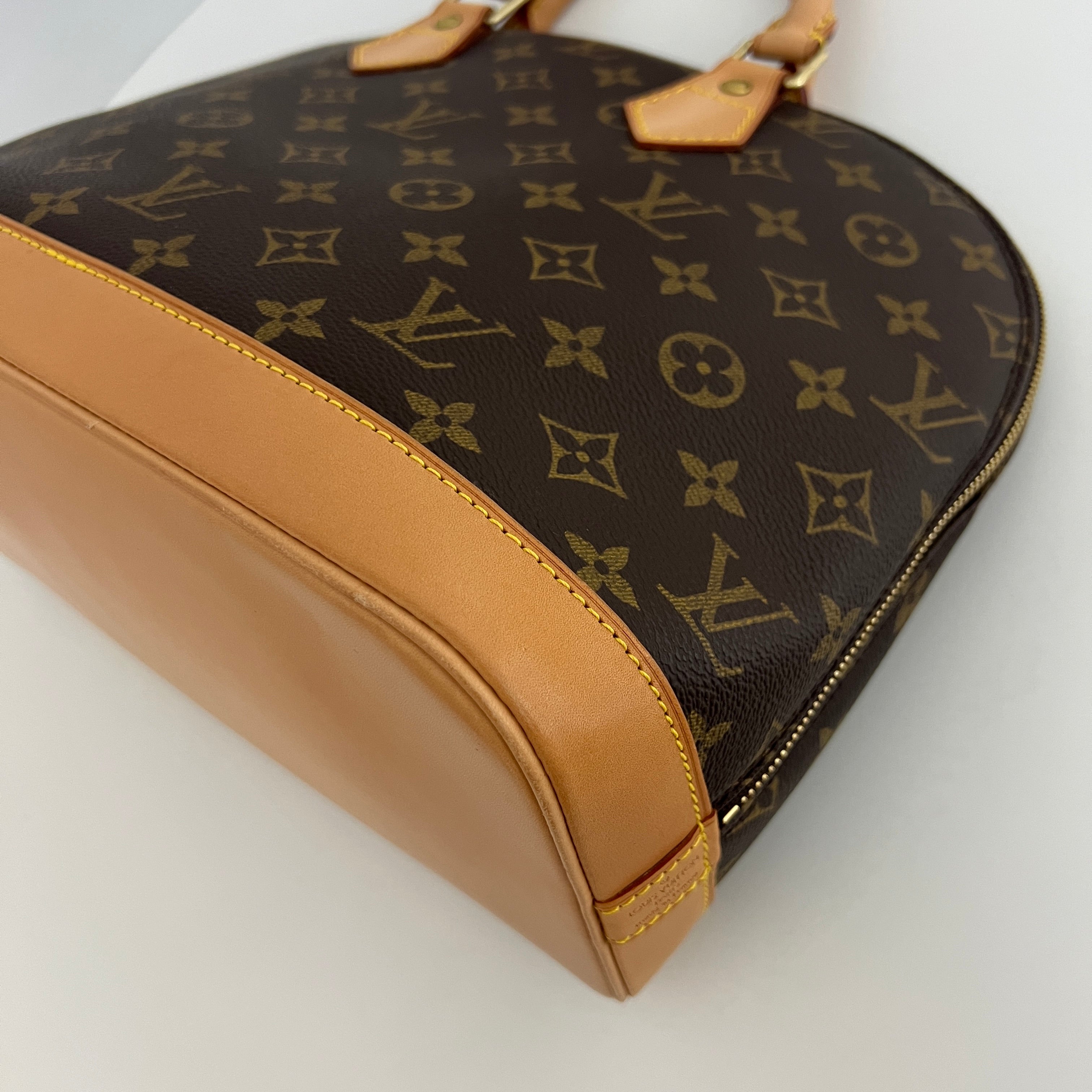 LOUIS VUITTON Alma PM handbag in brown canvas and leather