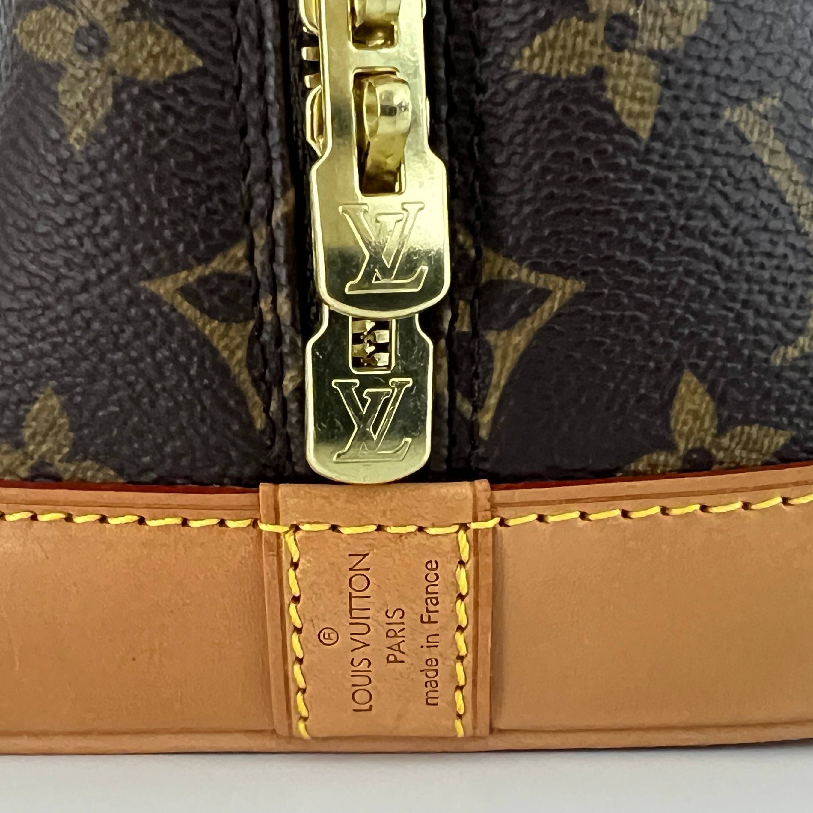 LOUIS VUITTON Alma PM handbag in brown canvas and leather