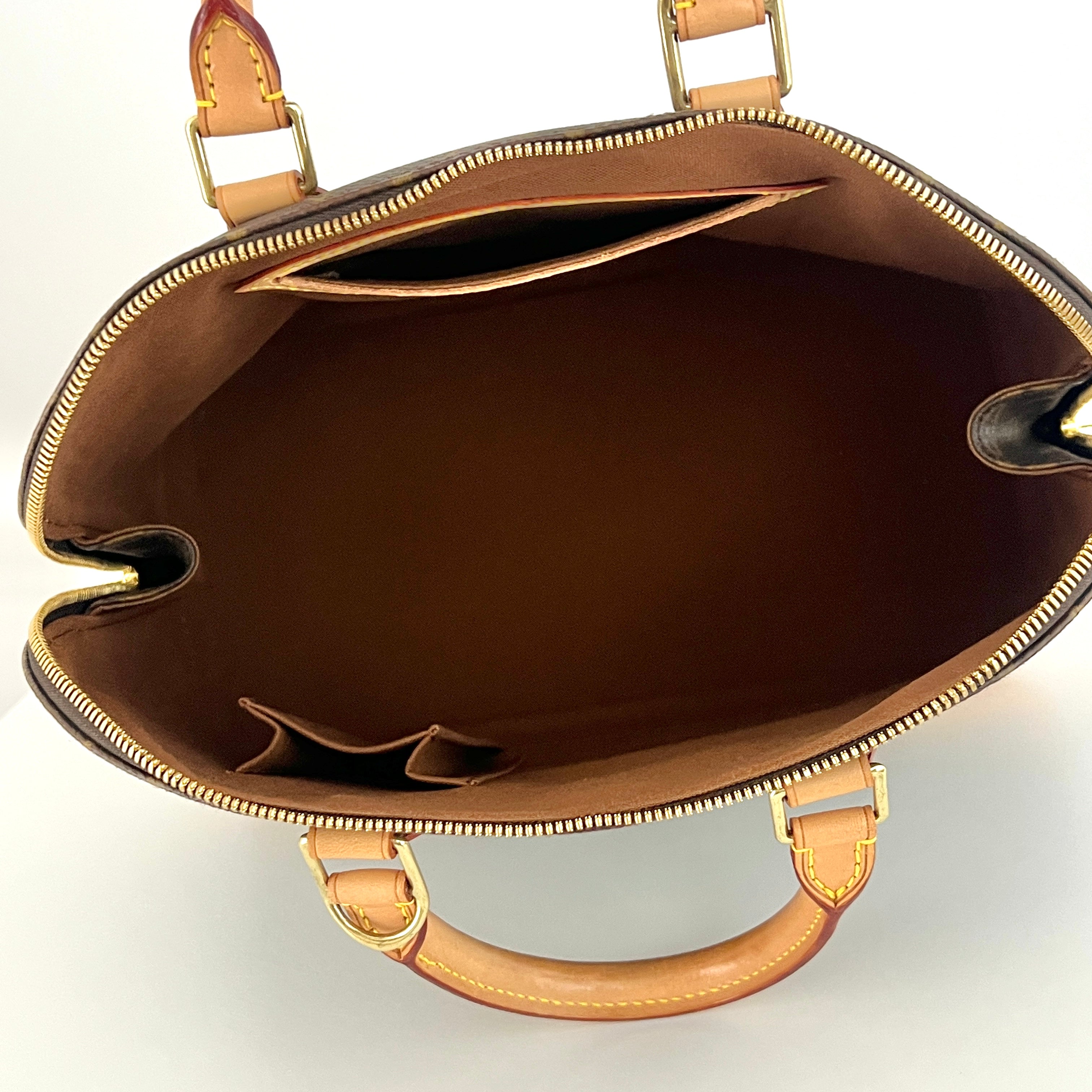 LOUIS VUITTON Alma PM handbag in brown canvas and leather