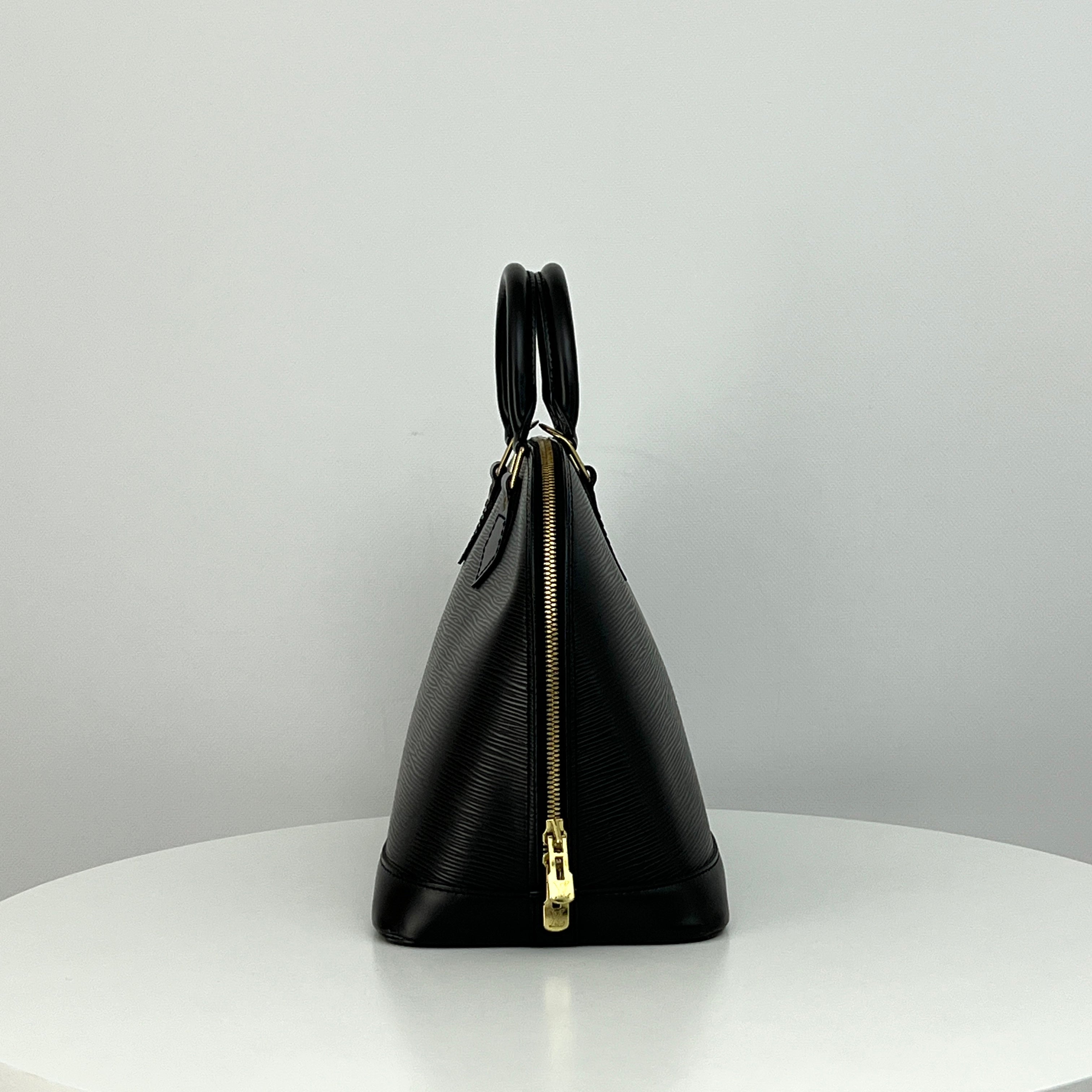 LOUIS VUITTON Alma PM handbag in black Epi leather