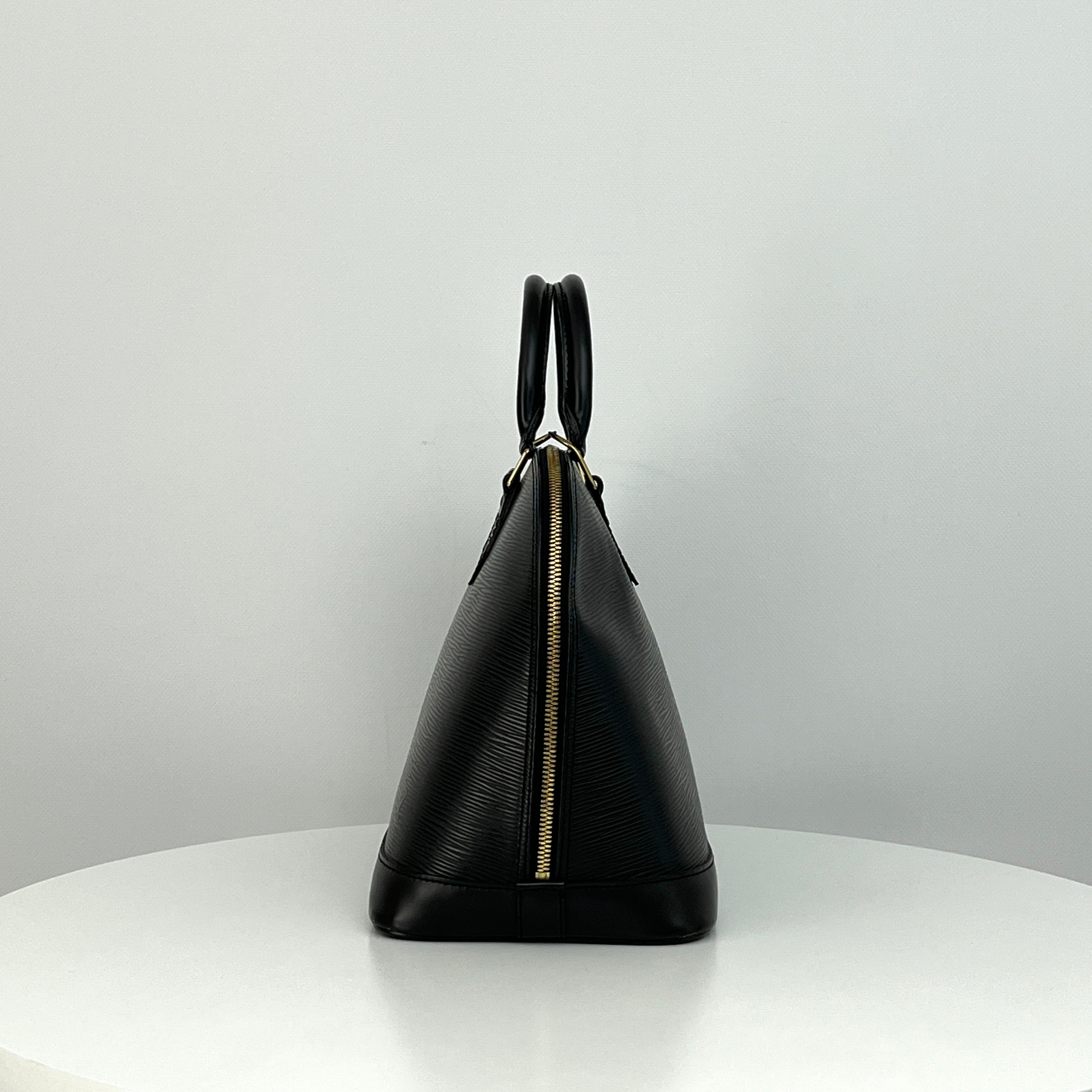 LOUIS VUITTON Alma PM handbag in black Epi leather