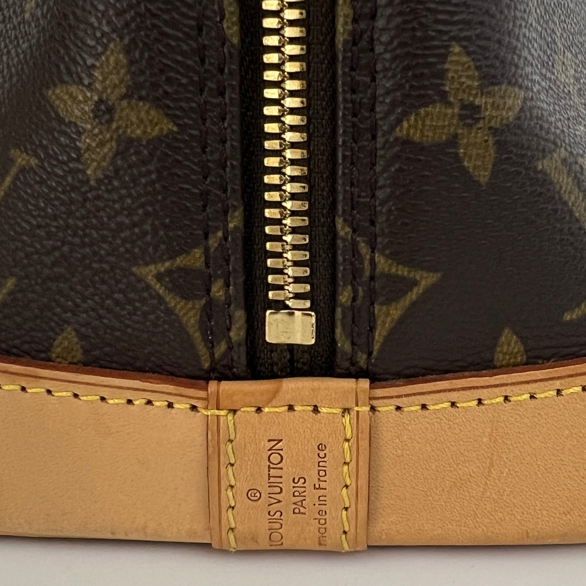 LOUIS VUITTON Alma PM handbag in brown canvas and leather