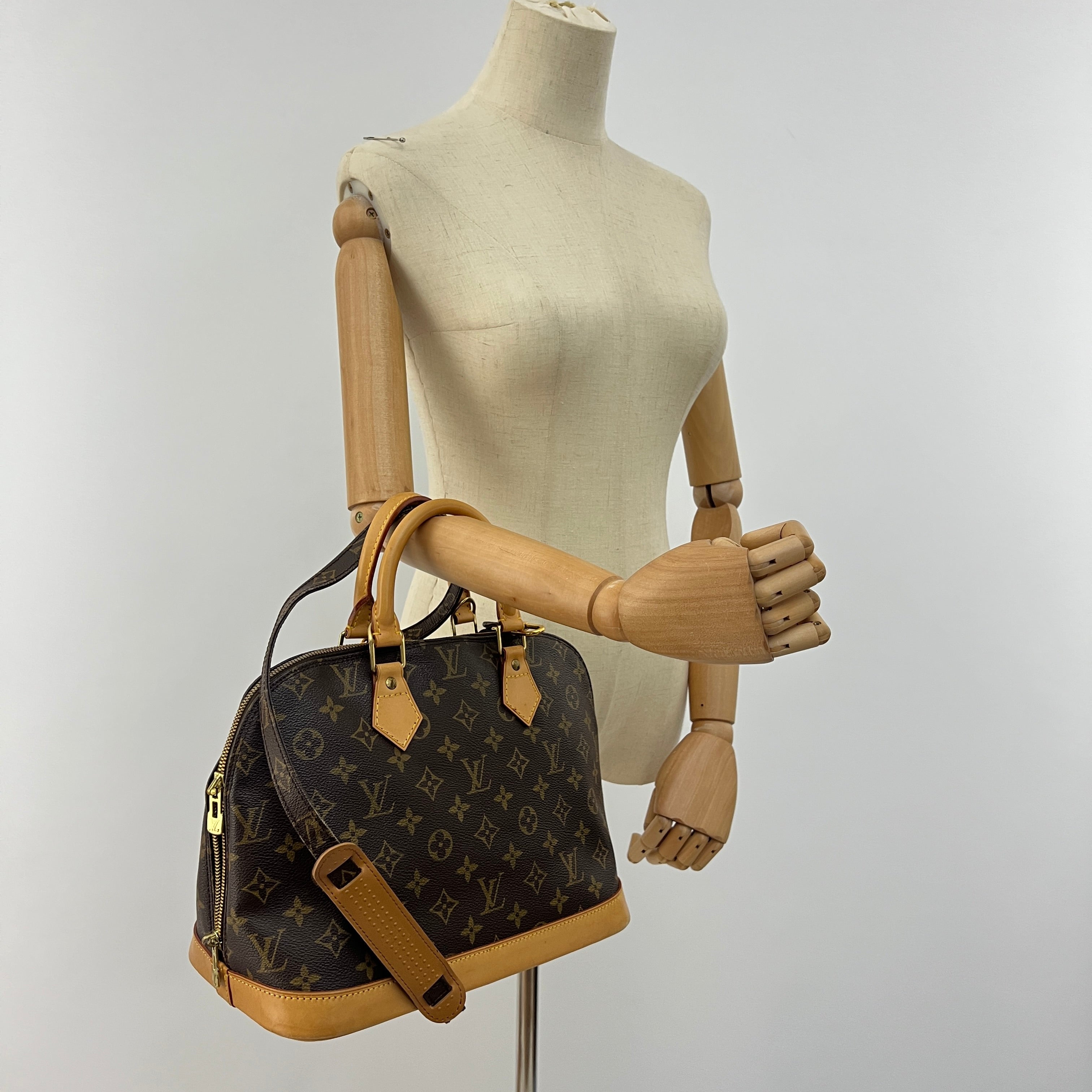 LOUIS VUITTON Alma PM handbag in brown canvas and leather