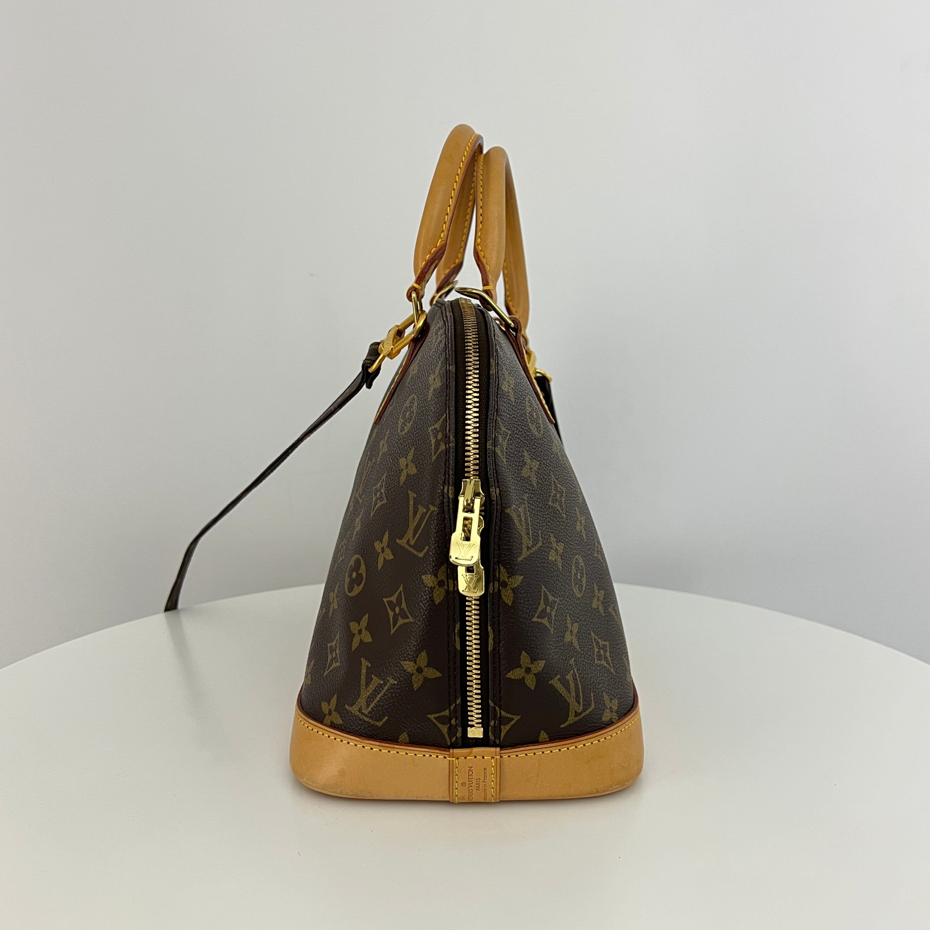 LOUIS VUITTON Alma PM handbag in brown canvas and leather