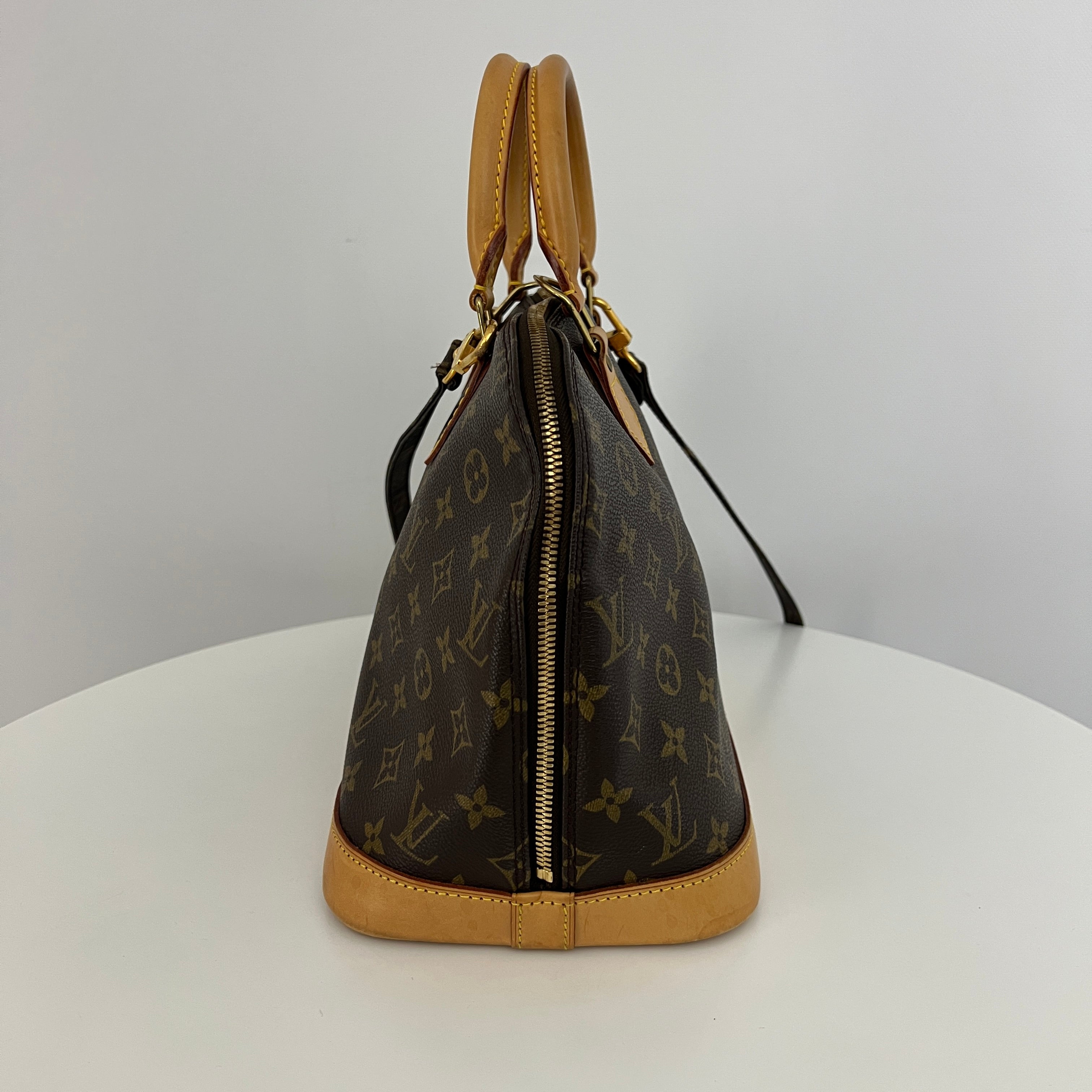 LOUIS VUITTON Alma PM handbag in brown canvas and leather