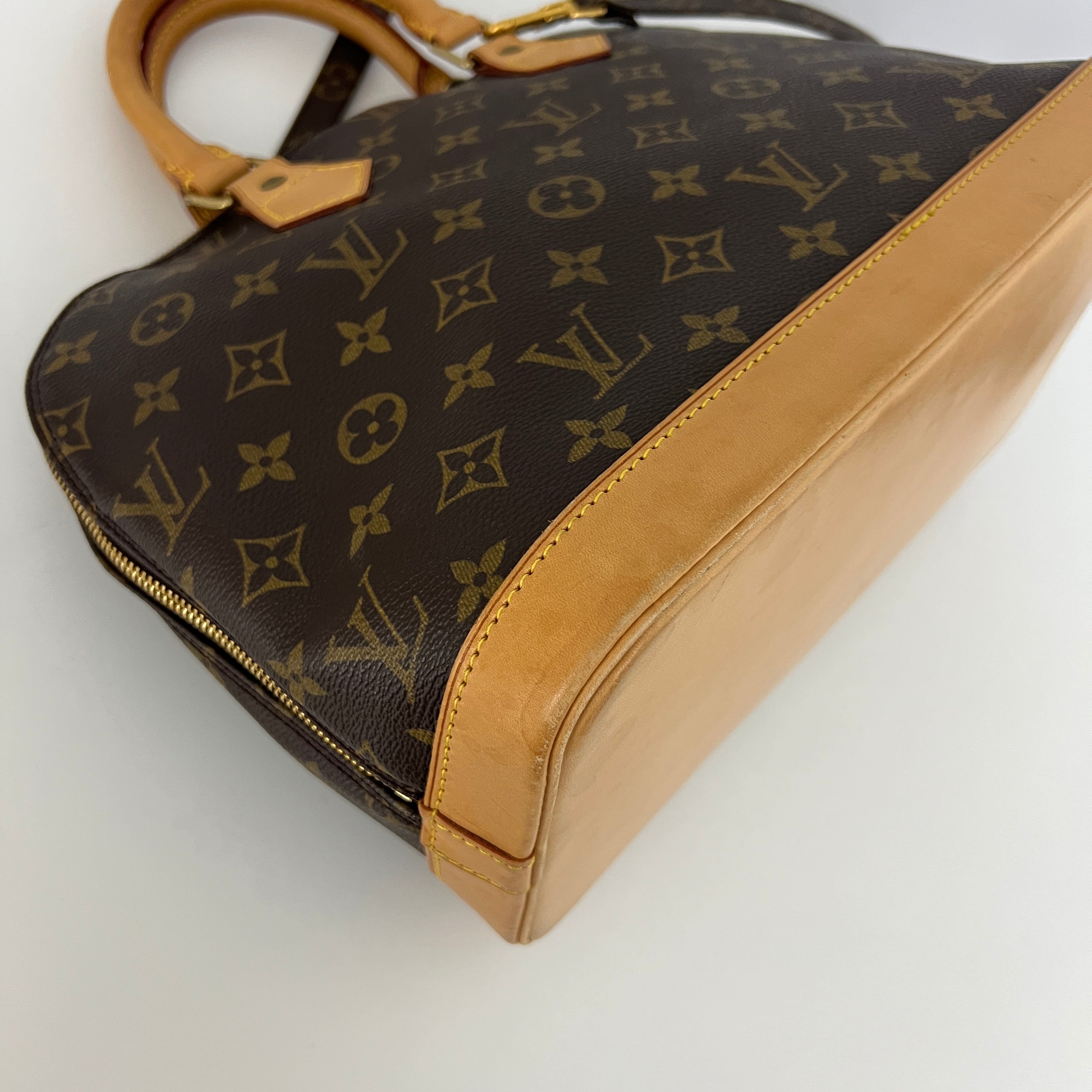 LOUIS VUITTON Alma PM handbag in brown canvas and leather
