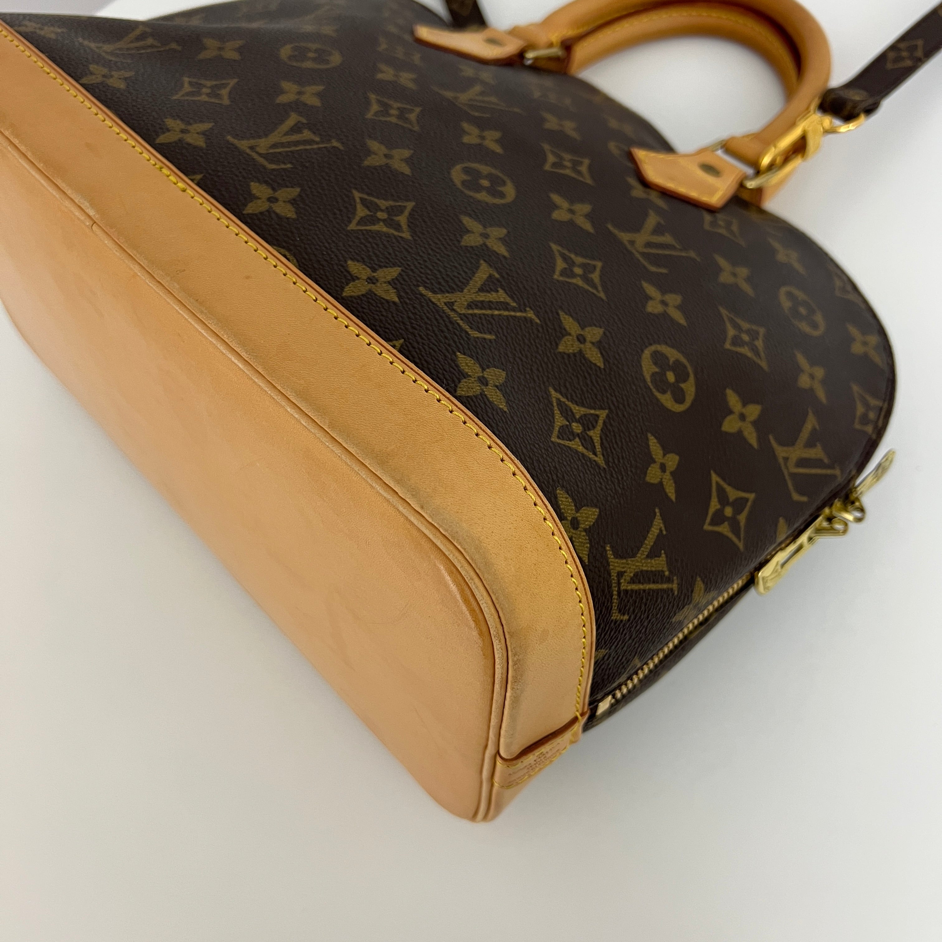 LOUIS VUITTON Alma PM handbag in brown canvas and leather