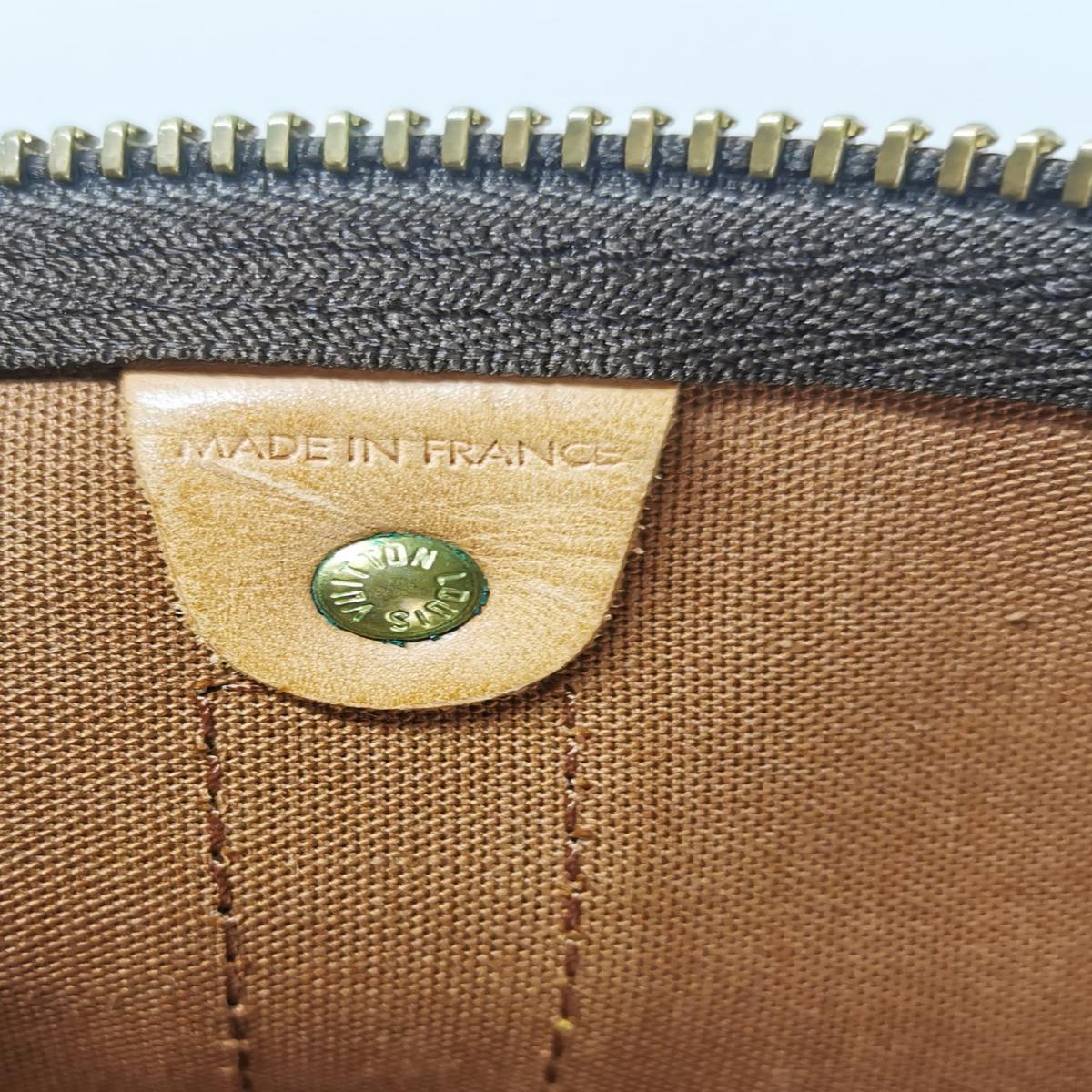 LOUIS VUITTON Keepall 55 canvas and leather travel bag Brown S082426