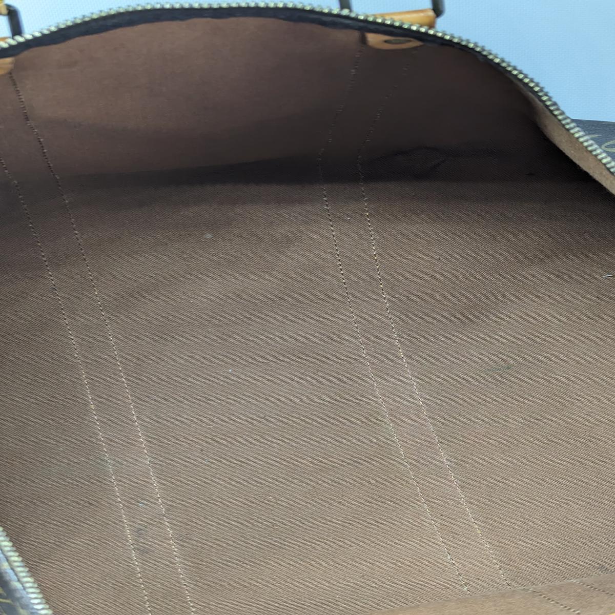 LOUIS VUITTON Keepall 55 canvas and leather travel bag Brown S072425