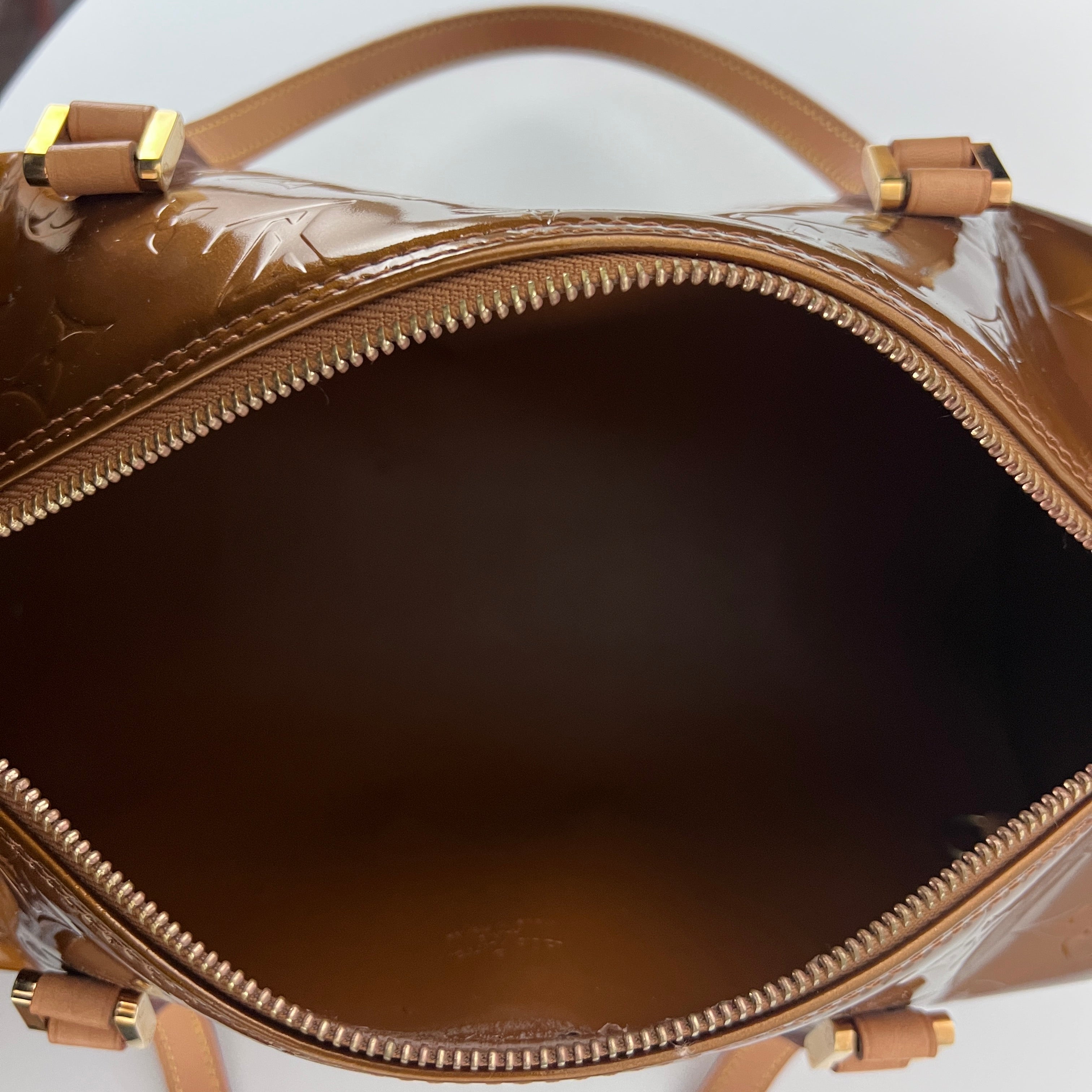 Sac LOUIS VUITTON Bedford cuir verni marron gold