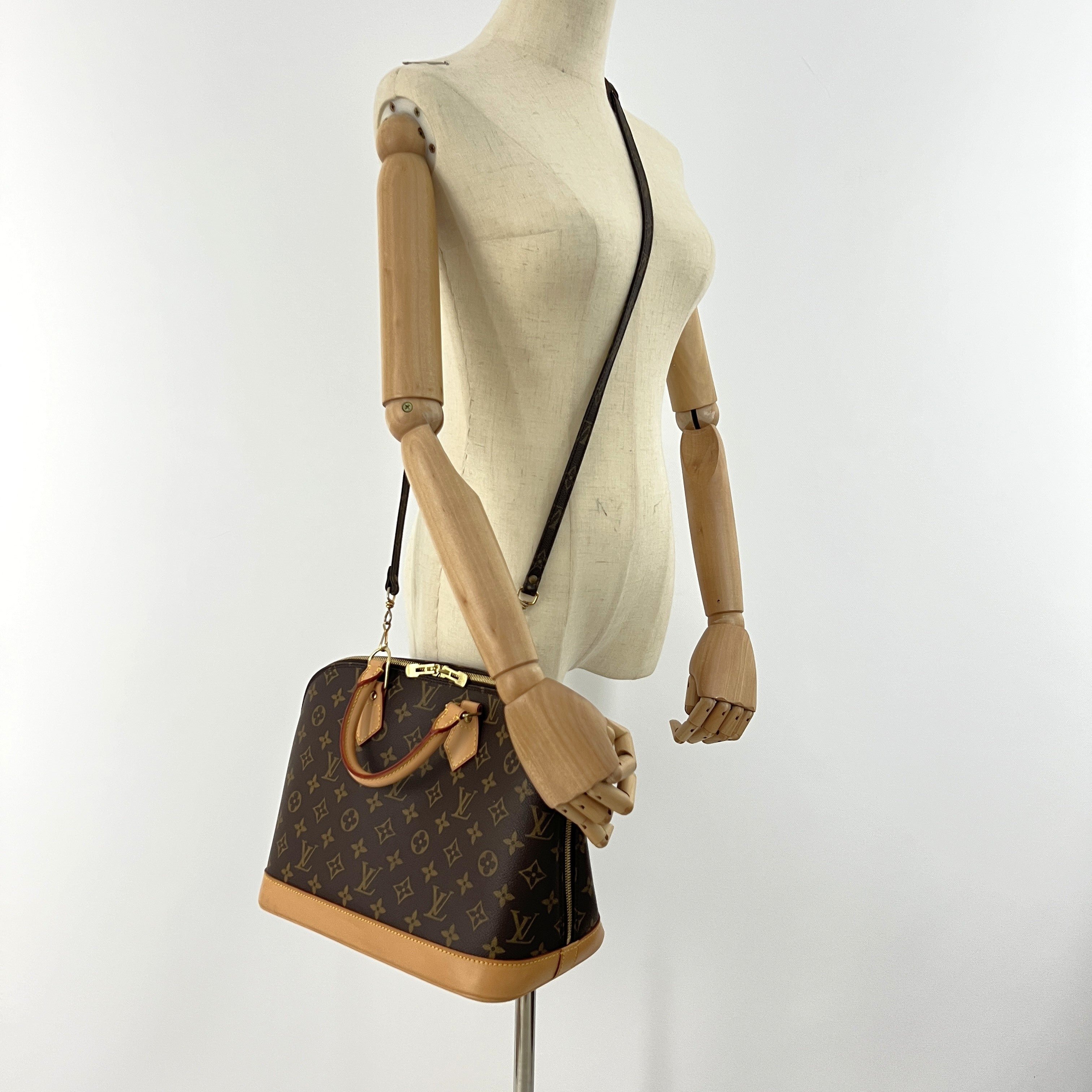 LOUIS VUITTON Alma PM handbag in brown canvas and leather