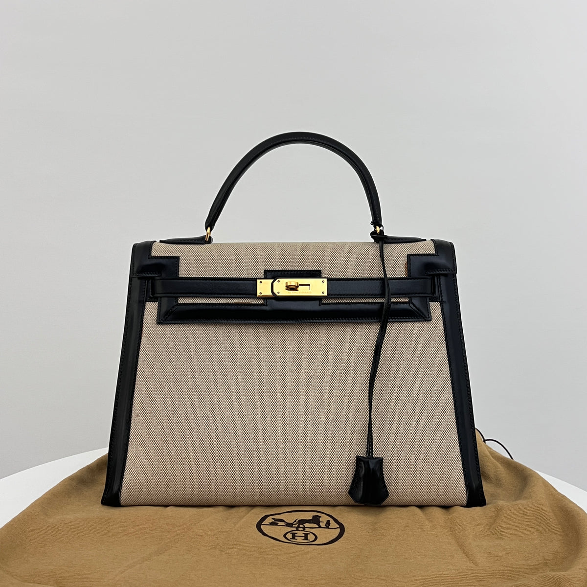 Sac HERMÈS Kelly 32 toile et cuir beige