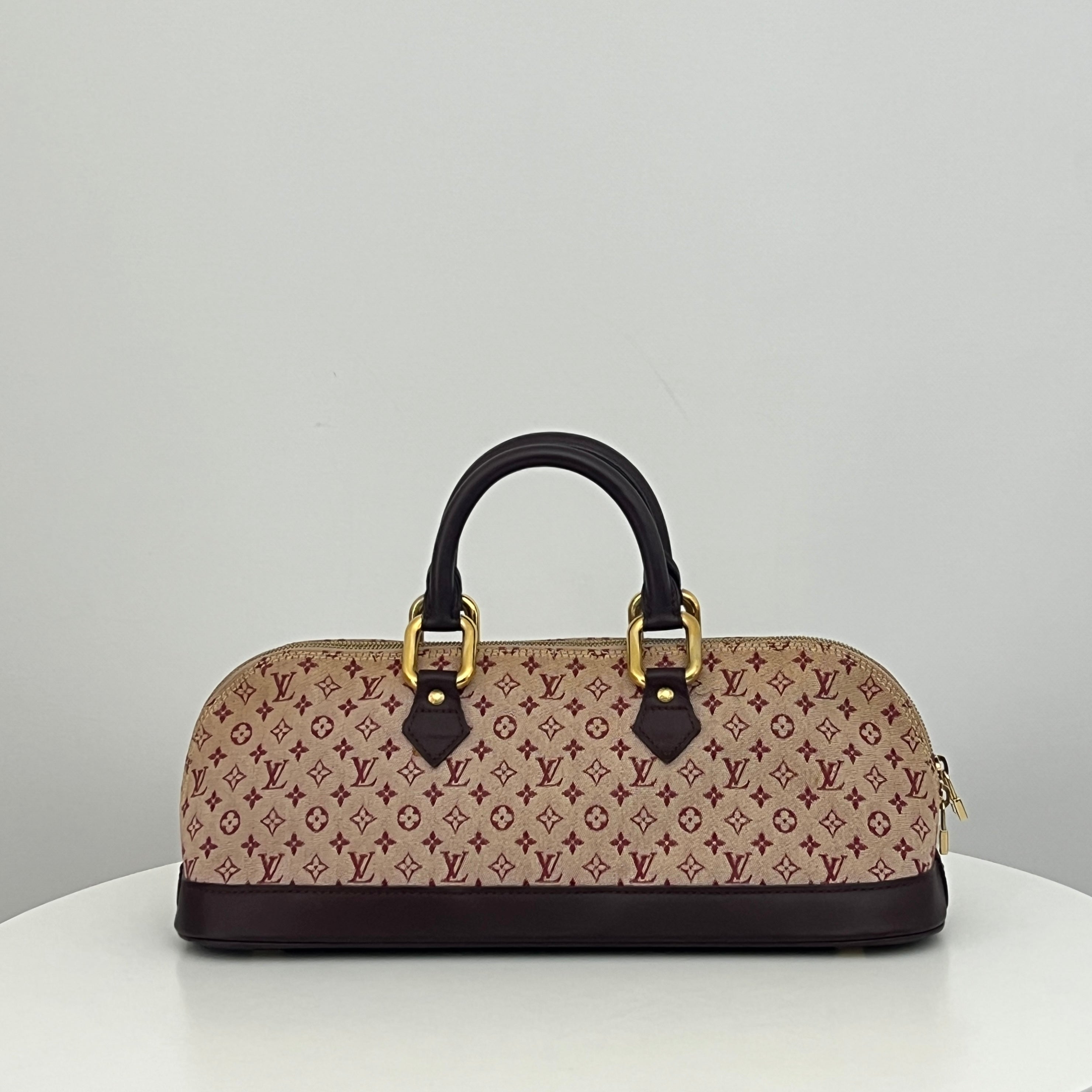 LOUIS VUITTON Alma Long bag in pink canvas and leather