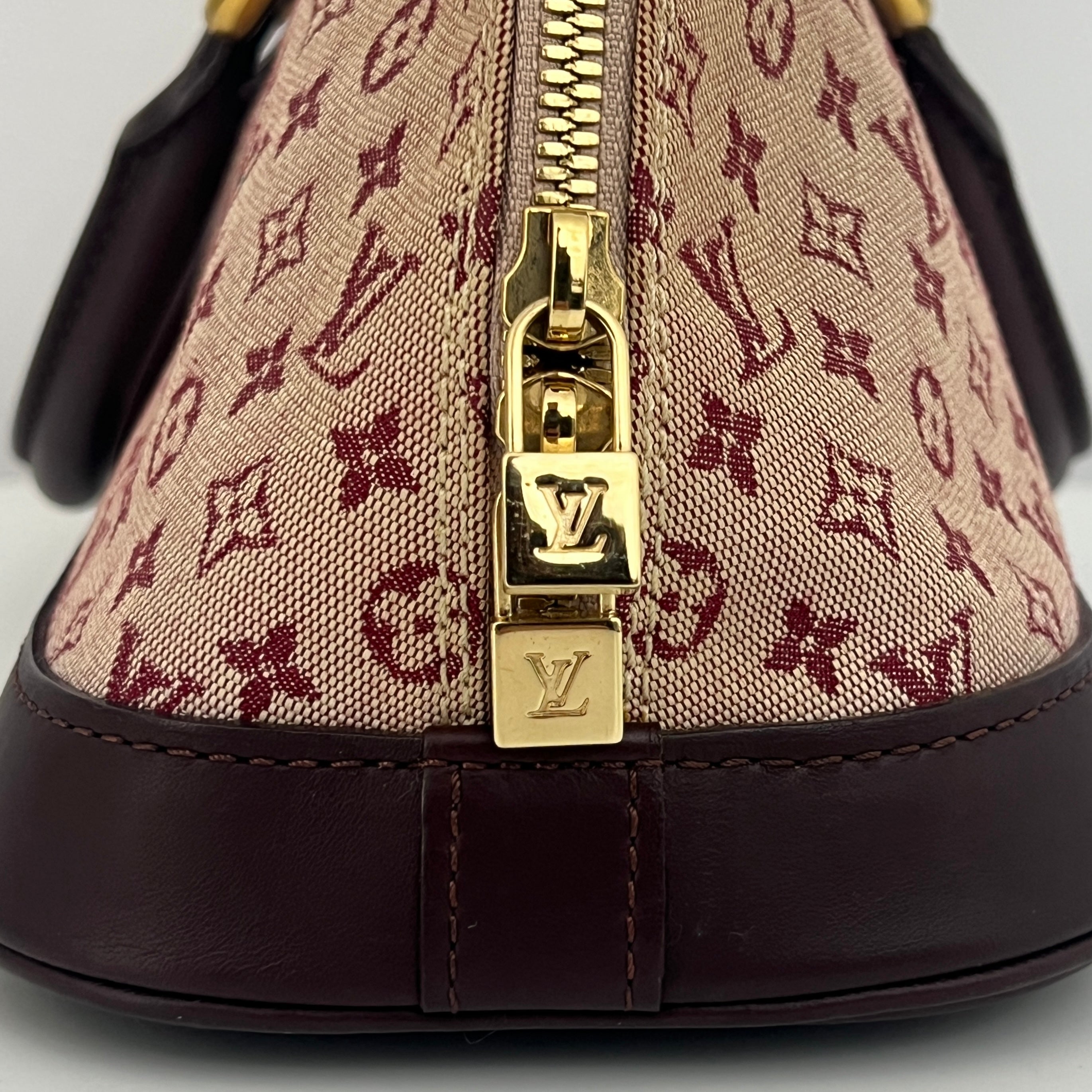 LOUIS VUITTON Alma Long bag in pink canvas and leather