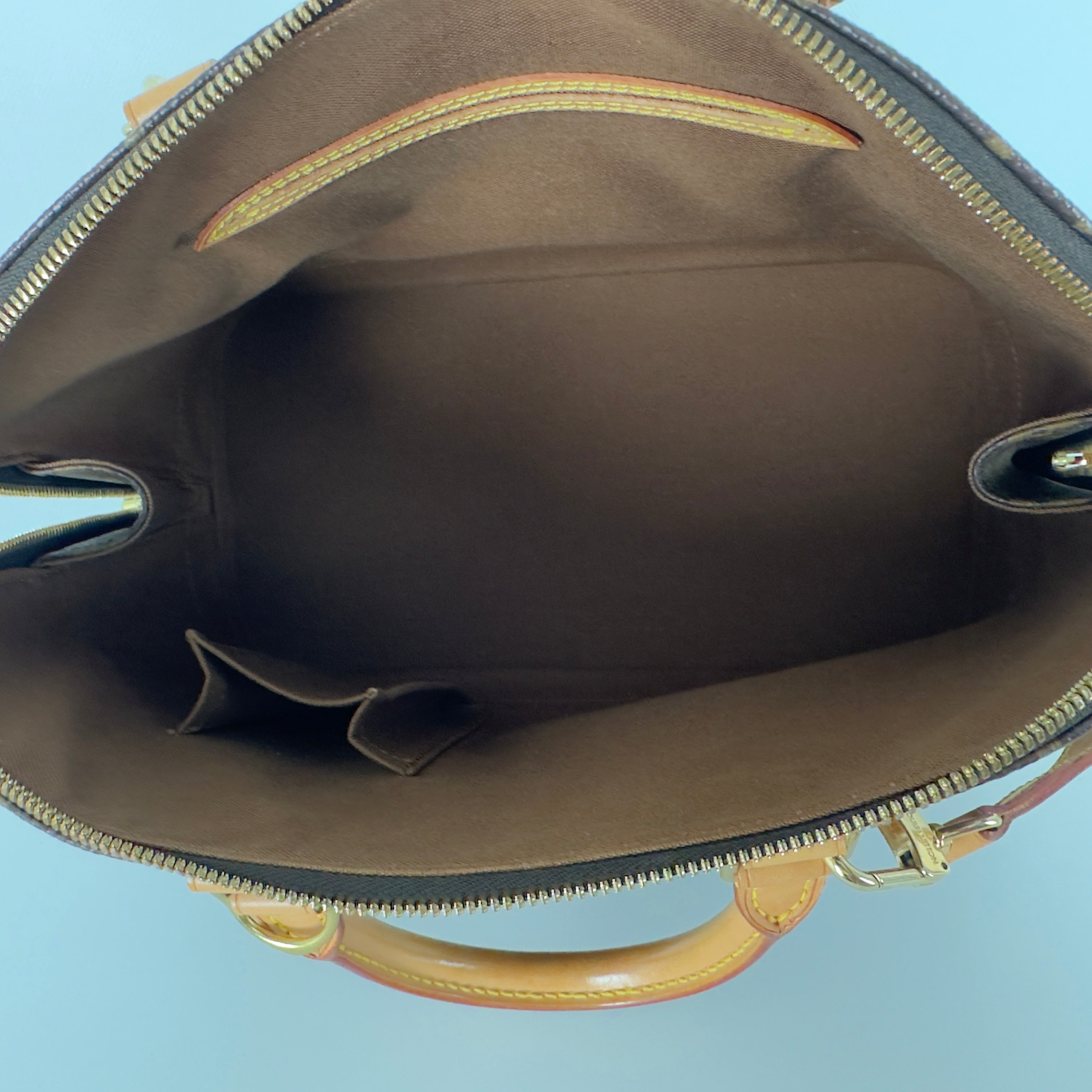 LOUIS VUITTON Alma MM handbag in brown canvas and leather