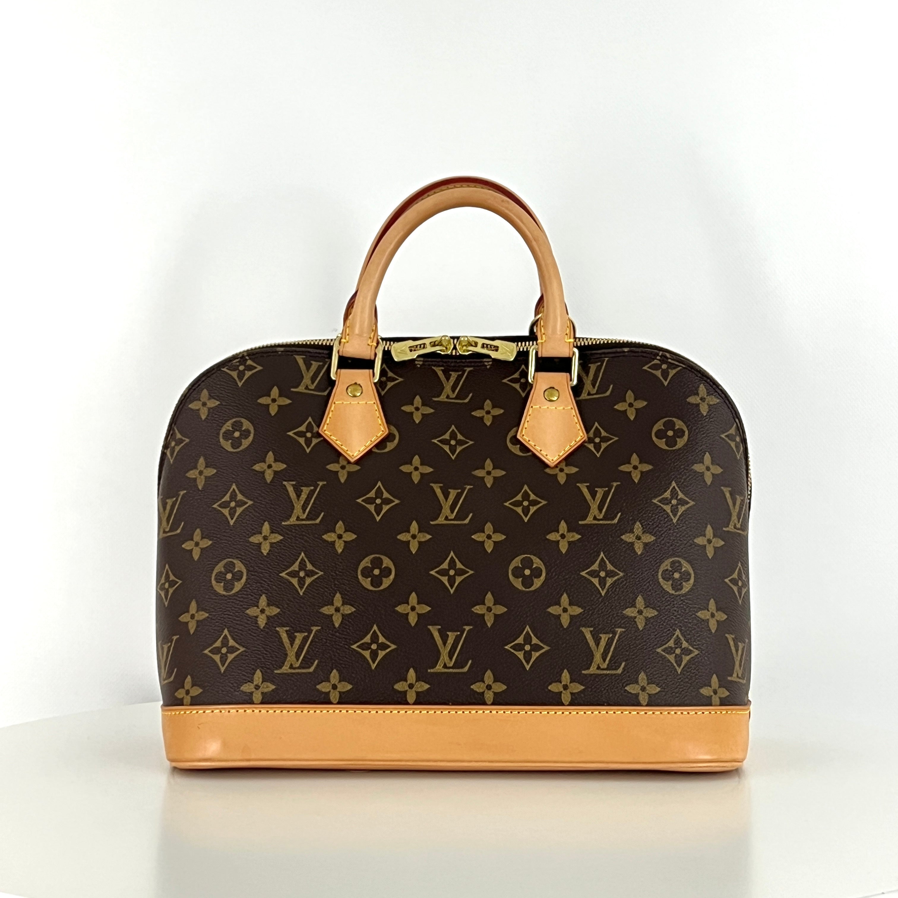 LOUIS VUITTON Alma PM handbag in brown canvas and leather