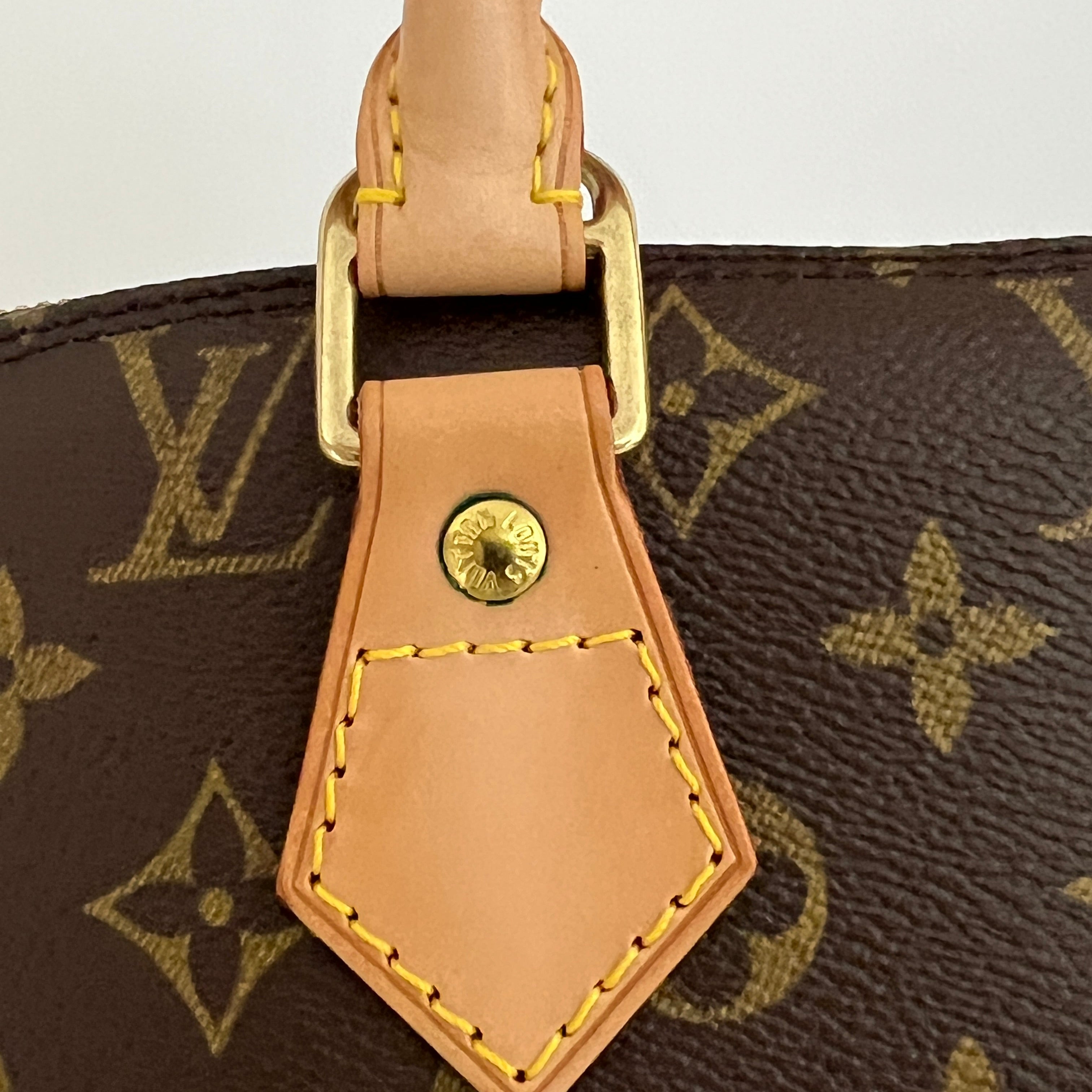 LOUIS VUITTON Alma PM handbag in brown canvas and leather