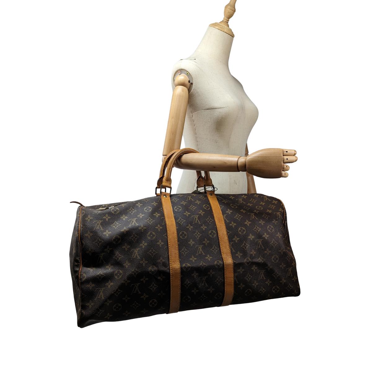 LOUIS VUITTON Keepall 55 canvas and leather travel bag Brown S072425