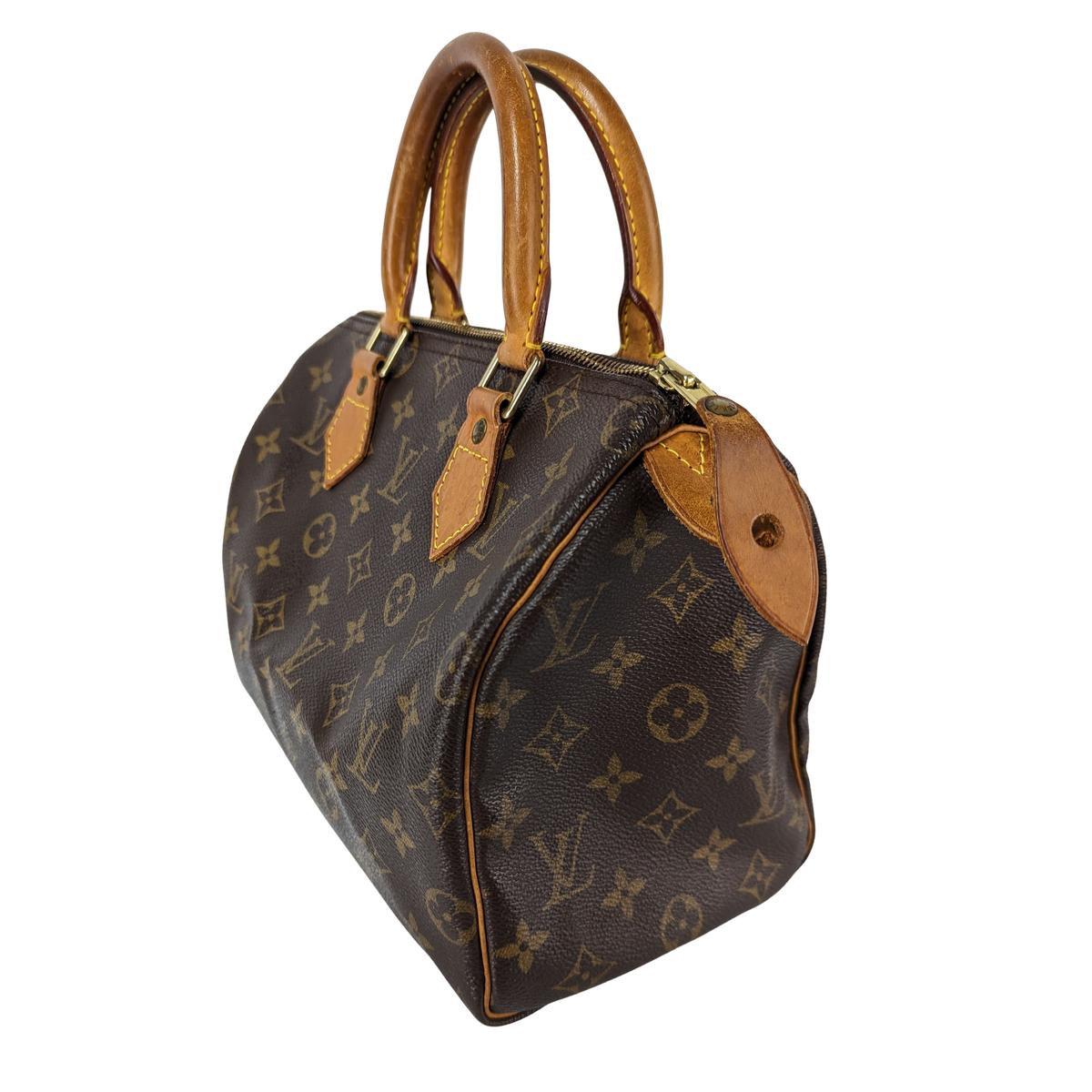 LOUIS VUITTON Speedy 25 canvas and leather handbag Brown