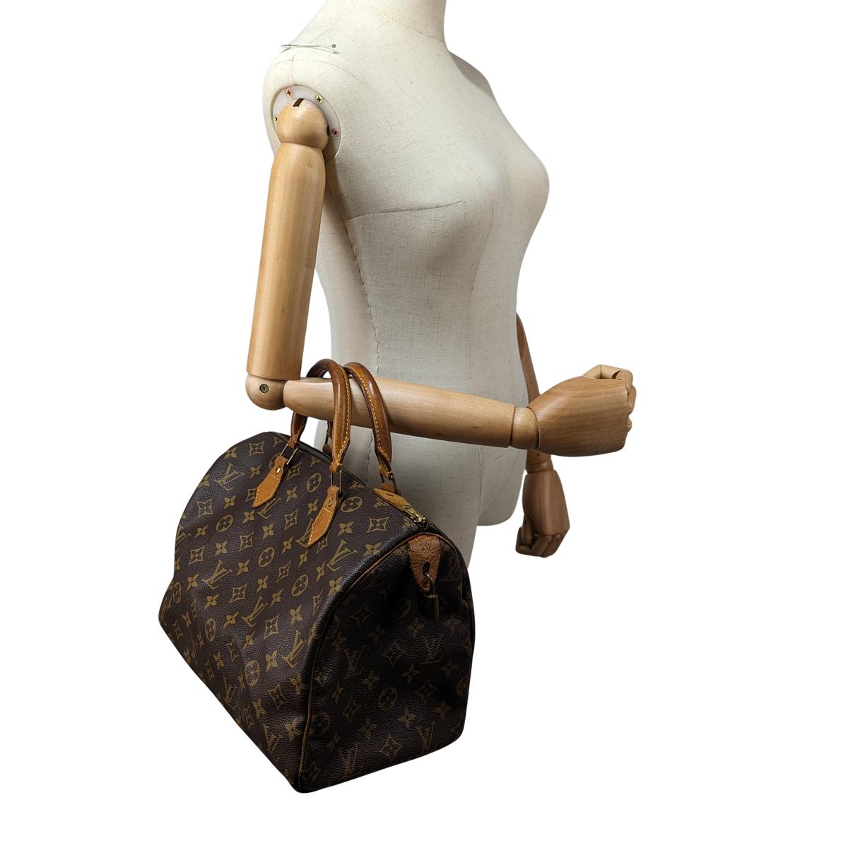 LOUIS VUITTON Speedy 30 canvas and leather handbag Brown